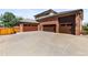 This home boasts a three-car garage with attractive doors and lots of parking at 5925 Zinnia Ct, Arvada, CO 80004