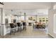 Open kitchen with a large island, breakfast bar, pendant lighting, and seamless access to the dining area at 5925 Zinnia Ct, Arvada, CO 80004