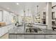 Modern kitchen with granite countertops and stainless steel appliances at 5925 Zinnia Ct, Arvada, CO 80004