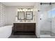 Elegant bathroom with double vanity, modern fixtures, and a separate glass-enclosed shower at 1931 Foothills Rd, Golden, CO 80401