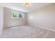 Bright bedroom with neutral carpet, radiator and a window with green views at 1931 Foothills Rd, Golden, CO 80401