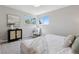 Well-lit bedroom with large windows, neutral decor and comfortable seating area at 1931 Foothills Rd, Golden, CO 80401