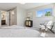 Serene bedroom featuring ample natural light, neutral decor, and carpeted floors at 1931 Foothills Rd, Golden, CO 80401