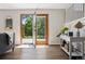 Bright entryway featuring wood floors, modern decor, and direct access to the outdoor patio at 1931 Foothills Rd, Golden, CO 80401