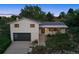 Charming home featuring a modern garage door, stylish front landscaping, and a welcoming entrance at 1931 Foothills Rd, Golden, CO 80401