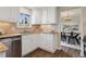 Kitchen view showcasing granite countertops, stainless steel appliances, and natural light at 1931 Foothills Rd, Golden, CO 80401