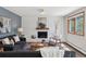 Living room features a modern fireplace, large windows and hardwood floors at 1931 Foothills Rd, Golden, CO 80401