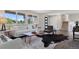 Bright living room with large windows, modern furniture, and stylish hardwood floors at 1931 Foothills Rd, Golden, CO 80401