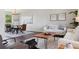 Open living room and dining area featuring hardwood floors and neutral tones at 1931 Foothills Rd, Golden, CO 80401