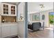 Open-concept living room with natural light, modern finishes, and a view of the updated kitchen at 1931 Foothills Rd, Golden, CO 80401