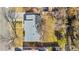 Overhead view of a house with a gray roof, a well-maintained yard, and mature trees in a quiet neighborhood at 6359 Brooks Dr, Arvada, CO 80004