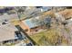 Aerial shot of a home with mature trees, well-maintained lawn, red brick, and neighborhood setting at 6359 Brooks Dr, Arvada, CO 80004