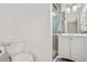 Bright bathroom features a modern vanity, glass enclosed shower, and a neutral color scheme at 6359 Brooks Dr, Arvada, CO 80004
