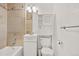 Bathroom with tiled shower, built in shelving, and vanity with ample storage at 6359 Brooks Dr, Arvada, CO 80004