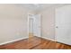 Bedroom featuring hardwood floors, neutral walls and white trim at 6359 Brooks Dr, Arvada, CO 80004