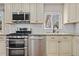 Bright kitchen featuring stainless appliances, white subway tile backsplash, and window over sink at 6359 Brooks Dr, Arvada, CO 80004