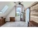 Bright bedroom with a barn door and large windows, and carpeted floors for warmth and comfort at 220 Wark Ave, Berthoud, CO 80513