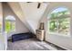 Bright bedroom featuring large windows with scenic views, modern furnishings, and carpet flooring at 220 Wark Ave, Berthoud, CO 80513