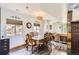 Bright dining room with hardwood floors and stylish light fixture at 220 Wark Ave, Berthoud, CO 80513