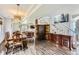Open dining area with staircase and decorative accents at 220 Wark Ave, Berthoud, CO 80513