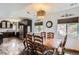 Elegant dining area with dark cabinets and stainless steel appliances at 220 Wark Ave, Berthoud, CO 80513