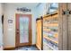 Inviting entry with decorative front door and sliding barn door at 220 Wark Ave, Berthoud, CO 80513