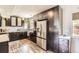 Modern kitchen with stainless steel appliances and dark cabinets at 220 Wark Ave, Berthoud, CO 80513
