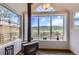 Inviting living room featuring a classic wood-burning stove, with large windows that frame the scenic views at 220 Wark Ave, Berthoud, CO 80513