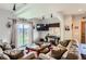 Comfortable living room with sliding glass doors leading outside at 220 Wark Ave, Berthoud, CO 80513