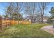 Backyard features a grass lawn and wooden fence at 6470 S Oak Ct, Littleton, CO 80127
