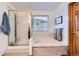 Bathroom with a shower, soaking tub, and window at 6470 S Oak Ct, Littleton, CO 80127