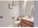 Powder room featuring modern fixtures, neutral tones, and stylish decor at 6470 S Oak Ct, Littleton, CO 80127