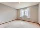 Bedroom with light grey carpet and light grey walls at 6470 S Oak Ct, Littleton, CO 80127