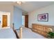 Well-lit bedroom with generous natural light, light blue accent wall, and views of the landing at 6470 S Oak Ct, Littleton, CO 80127
