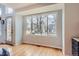 Inviting dining area with large windows, hardwood floors, and ample natural light, creating a warm and welcoming atmosphere at 6470 S Oak Ct, Littleton, CO 80127