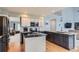 Well-appointed kitchen with granite countertops, stainless steel appliances, and hardwood floors, designed for culinary enthusiasts at 6470 S Oak Ct, Littleton, CO 80127