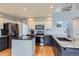 Stylish kitchen with granite countertops, stainless steel appliances, and a functional island, blending elegance and utility at 6470 S Oak Ct, Littleton, CO 80127