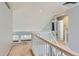 Second-floor landing boasting bright natural light and views of the home's vaulted ceilings at 6470 S Oak Ct, Littleton, CO 80127
