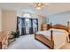Bright main bedroom featuring a vaulted ceiling, nice windows, and carpet flooring at 6470 S Oak Ct, Littleton, CO 80127