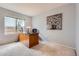 Cozy office with large window with a wood desk, and bright natural light at 6470 S Oak Ct, Littleton, CO 80127
