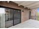 Balcony with sliding glass door and brick railing at 480 S Marion Pkwy # 802, Denver, CO 80209