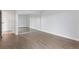 Bright bedroom featuring wood floors, large closet with mirror doors, and white walls at 480 S Marion Pkwy # 802, Denver, CO 80209