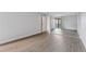 Bright empty room featuring wood floors and sliding mirrored closet at 480 S Marion Pkwy # 802, Denver, CO 80209