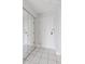 Hallway with coat closet, mirror closet doors, and tile flooring at 480 S Marion Pkwy # 802, Denver, CO 80209