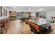 Game room features a pool table, ping pong table, foosball, and wood paneled walls at 480 S Marion Pkwy # 802, Denver, CO 80209