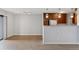 Bright living room featuring wood floors, modern lighting, and stainless steel refrigerator at 480 S Marion Pkwy # 802, Denver, CO 80209