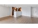 Bright living room featuring wood floors, modern lighting, and updated kitchen at 480 S Marion Pkwy # 802, Denver, CO 80209