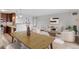 Open concept living room and dining area, with an adjacent kitchen at 480 S Marion Pkwy # 802, Denver, CO 80209