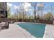 Outdoor pool area featuring a pool with a safety cover and surrounding wrought iron fence at 480 S Marion Pkwy # 802, Denver, CO 80209