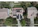Aerial view of a home featuring solar panels, a lawn, and a driveway at 19681 E 59Th Pl, Aurora, CO 80019